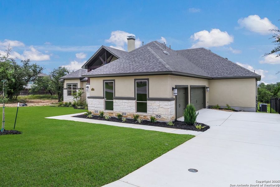 Front exterior of a new home in Johnson Ranch, Bulverde, TX, highlighting curb appeal (Image 2). Front exterior of a new home in Johnson Ranch, Bulverde, TX, highlighting curb appeal (Image 2).