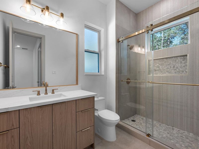 Each secondary bedroom includes an en-suite bathroom for added privacy.