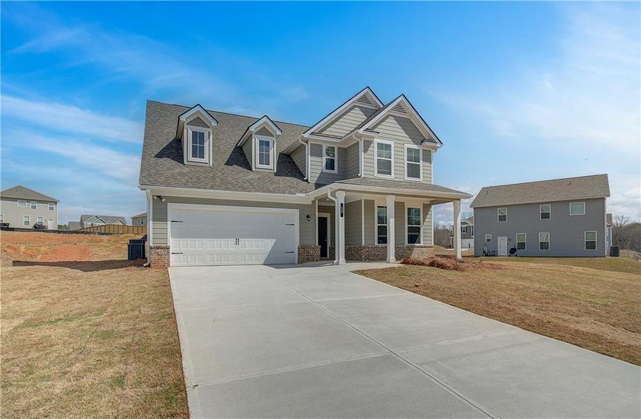 Front exterior of a new home in Chapel Hill, Newnan, GA, highlighting curb appeal (Image 15). Front exterior of a new home in Chapel Hill, Newnan, GA, highlighting curb appeal (Image 15).