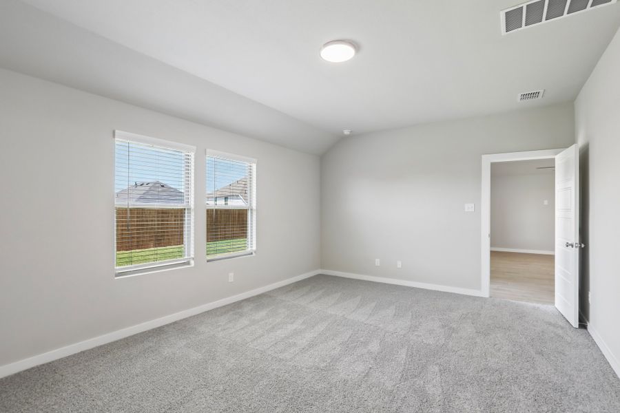 Primary Bedroom in the Oscar home plan by Trophy Signature Homes