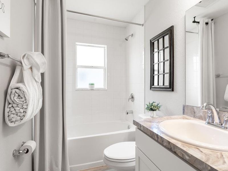 Secondary bedrooms share a convenient hall bath. Secondary bedrooms share a convenient hall bath.