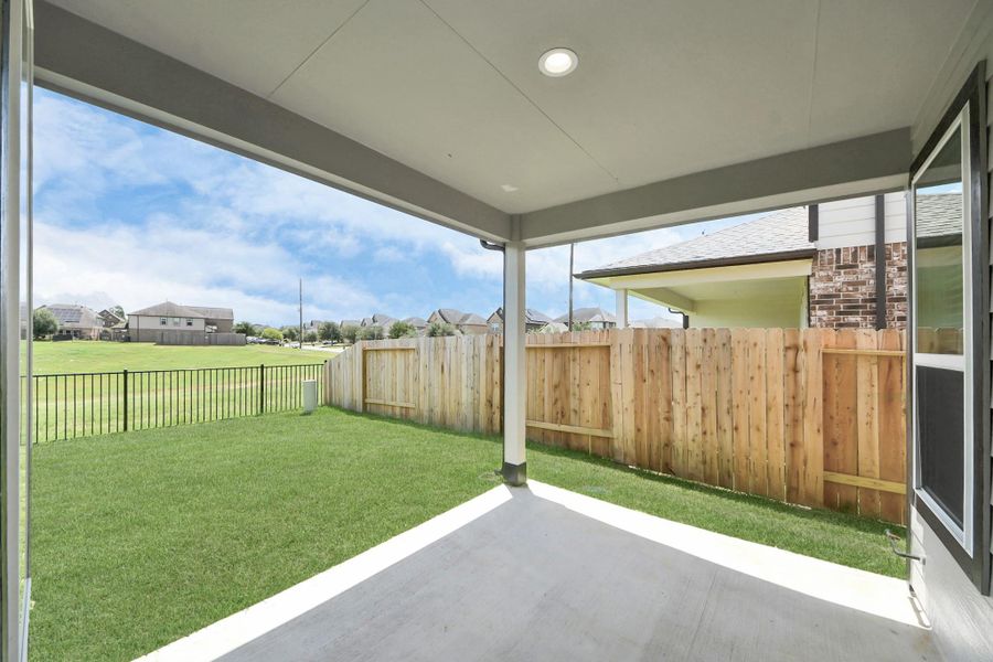 Experience outdoor living at its finest on this expansive covered patio, thoughtfully designed for BBQs and delightful outdoor dining. Experience outdoor living at its finest on this expansive covered patio, thoughtfully designed for BBQs and delightful outdoor dining.