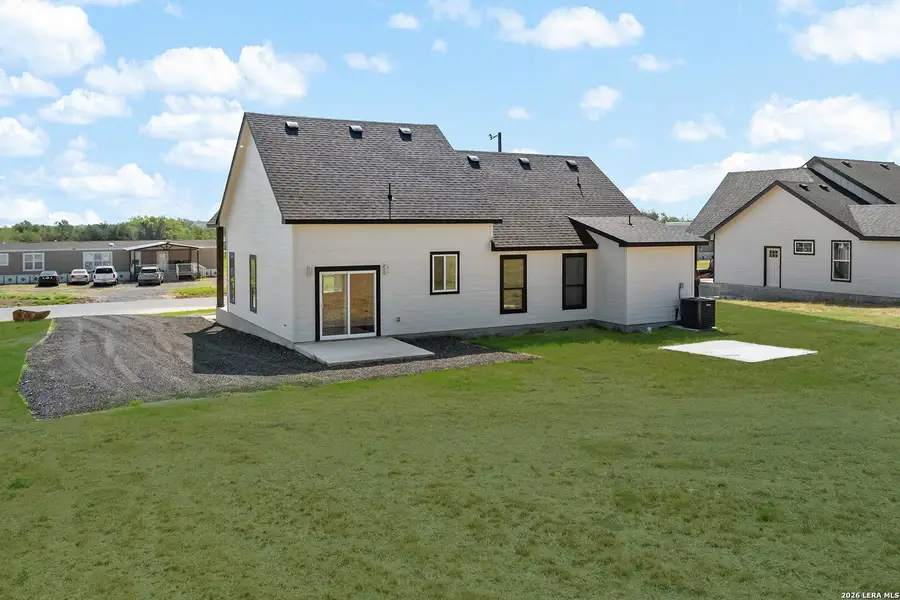 Exterior details and patio area of a home in , Atascosa (Image 3).