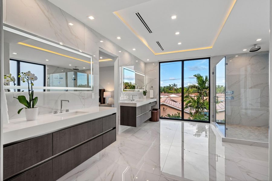 Double vanity and shower in the primary bathroom.