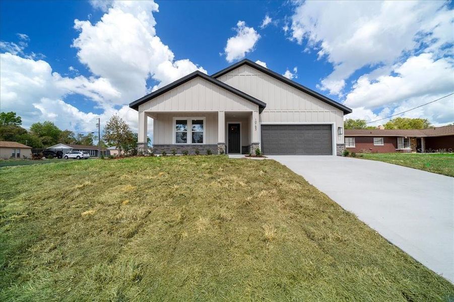 Front exterior of a new home in , Spring Hill, FL, highlighting curb appeal (Image 30).