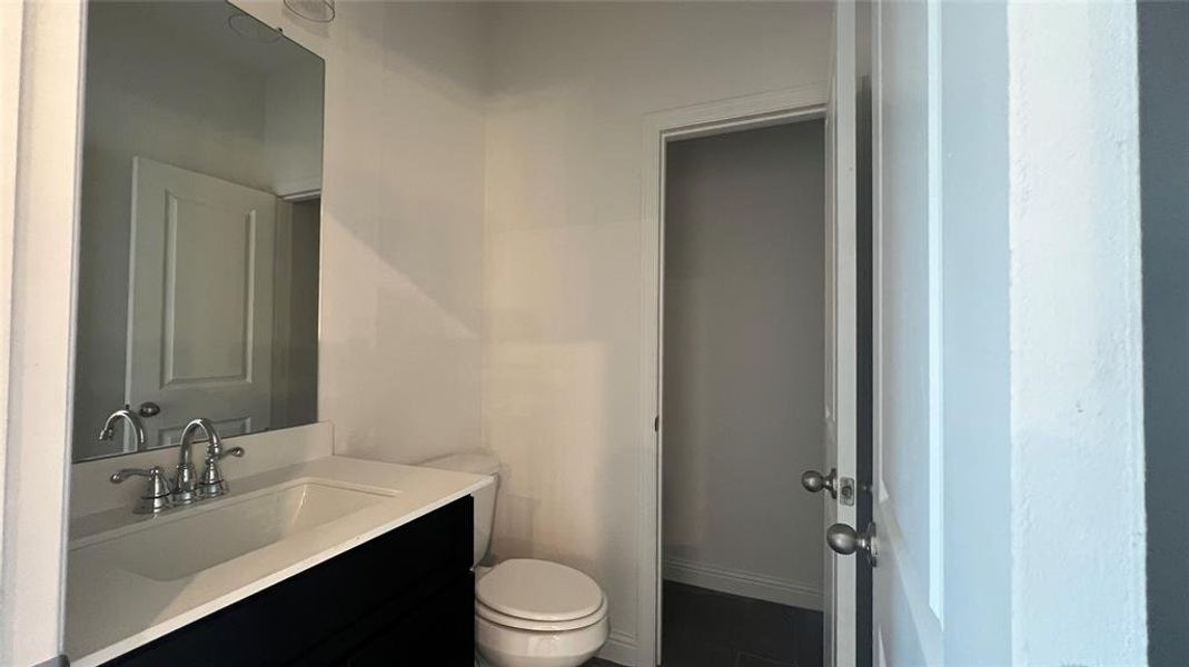 Upstairs Powder Bath with an extra storage closet