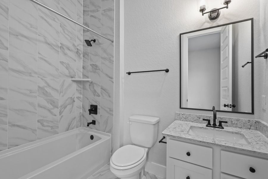 A bathroom with a shower and sink. A bathroom with a shower and sink.