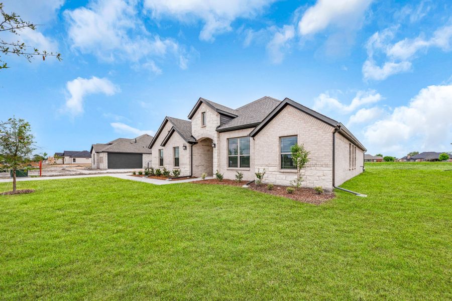 Front exterior of a new home in Mallard Point, Greenville, TX, highlighting curb appeal (Image 24).