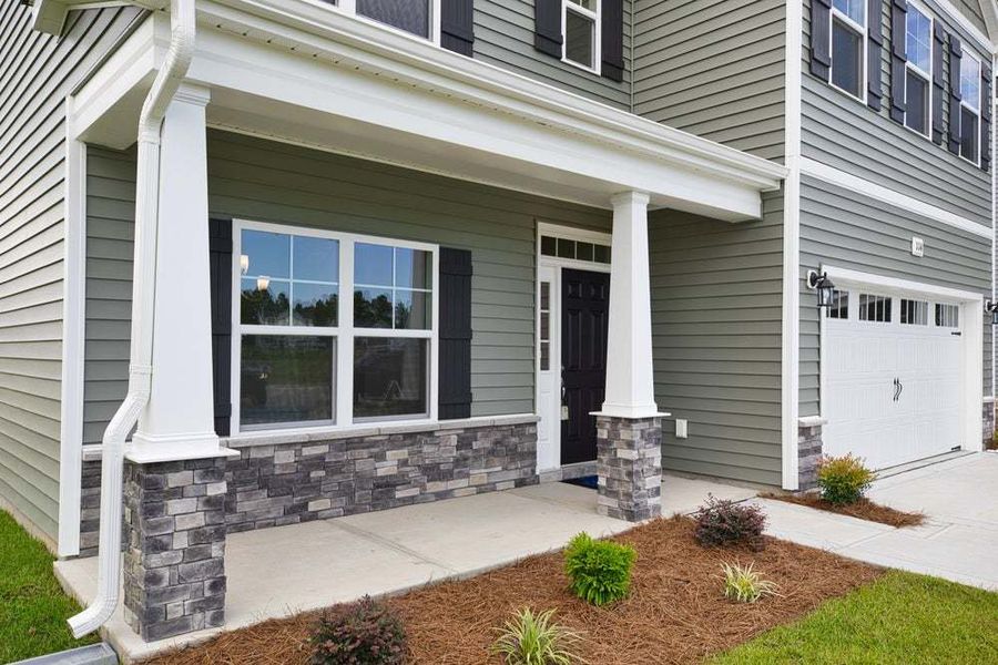 Representative exterior photo of a completed home built from the Pamlico by Caviness & Cates Communities in Bartlett Manor, Youngsville, NC (Image 18).