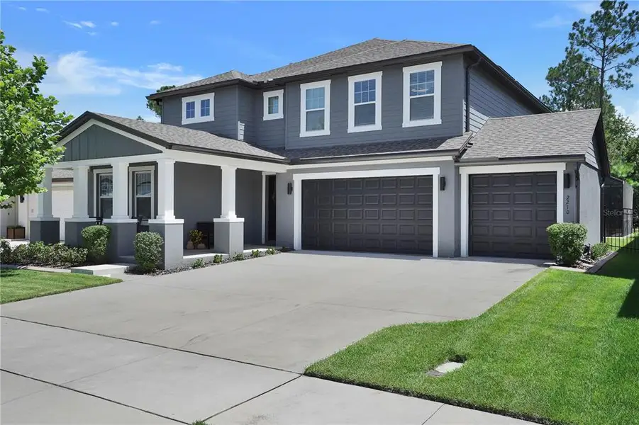 Front exterior of a new home in , Minneola, FL, highlighting curb appeal (Image 2). Front exterior of a new home in , Minneola, FL, highlighting curb appeal (Image 2).