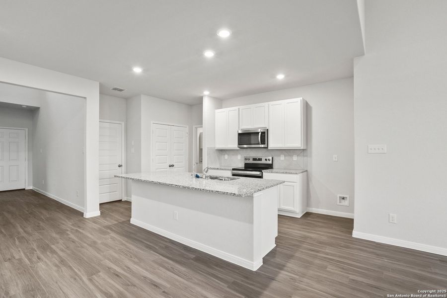 Furnished interior view inside a new home in Abbott Place, St. Hedwig (Image 11).