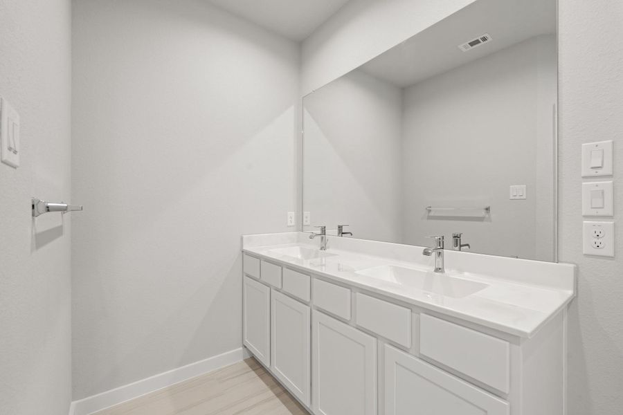 Furnished interior view inside a new home in Sunterra North, Katy (Image 10).