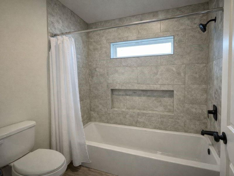 Furnished interior view inside a new home in Frontier Lakes, Willis (Image 6).