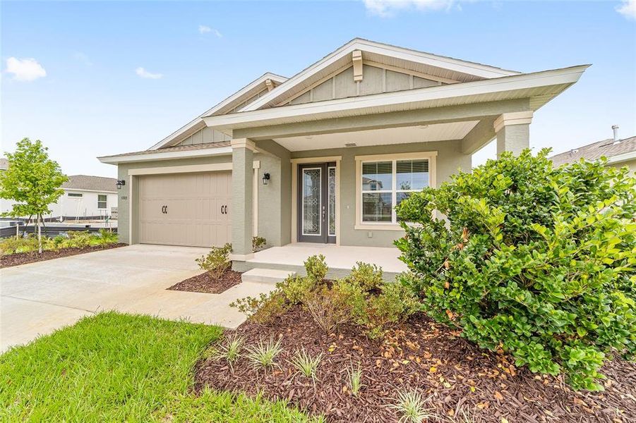 Front exterior of a new home in Calesa Township, Ocala, FL, highlighting curb appeal (Image 24). Front exterior of a new home in Calesa Township, Ocala, FL, highlighting curb appeal (Image 24).