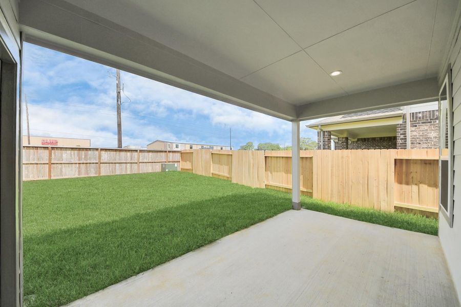 Experience outdoor living at its finest on this expansive covered patio, thoughtfully designed for BBQs and delightful outdoor dining. Sample photo of completed home with similar floor plan. Actual colors and selections may vary. Experience outdoor living at its finest on this expansive covered patio, thoughtfully designed for BBQs and delightful outdoor dining. Sample photo of completed home with similar floor plan. Actual colors and selections may vary.