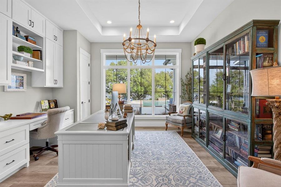 There are TWO executive offices in this home. This one faces the back and captures the views.