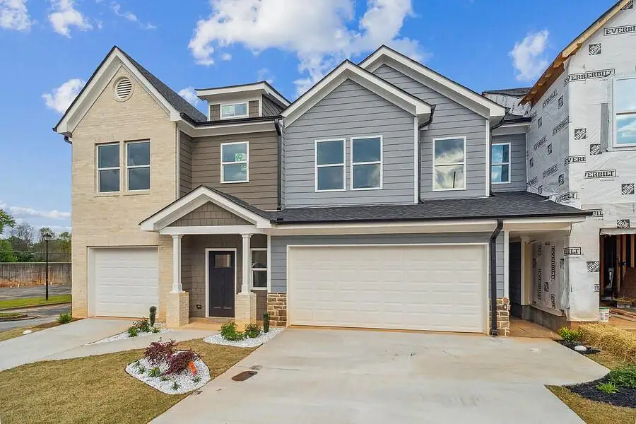 Front exterior of a new home in , Stone Mountain, GA, highlighting curb appeal (Image 1).