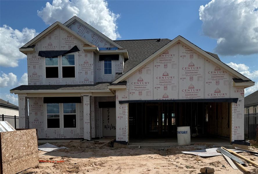In-progress construction of a new home in Sunterra, Katy, TX (Image 34).