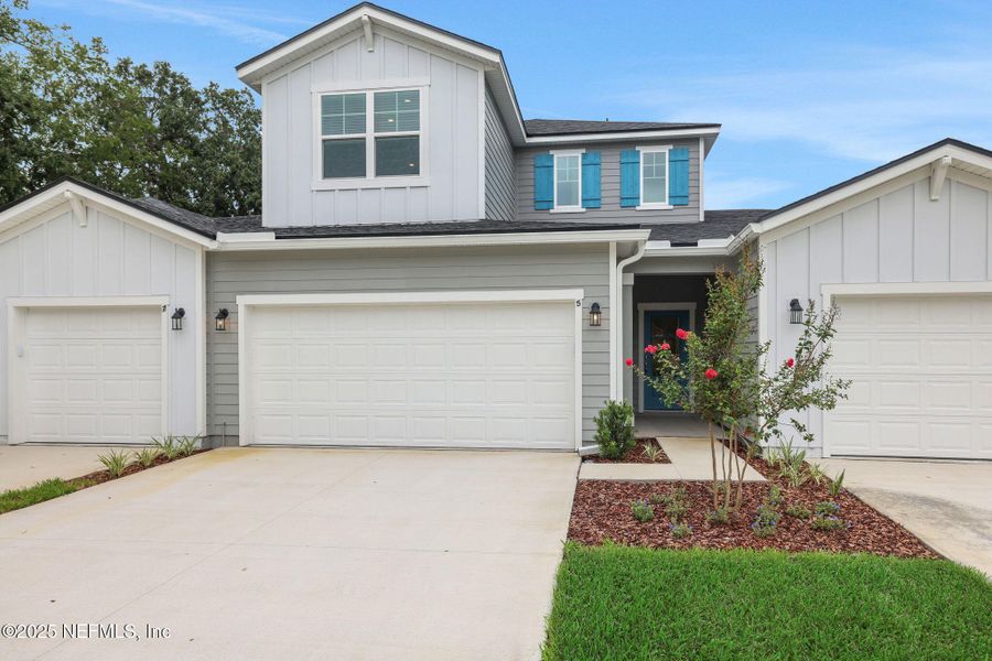 Front exterior of a new home in The Hammock at Palm Harbor, Palm Coast, FL, highlighting curb appeal (Image 16).