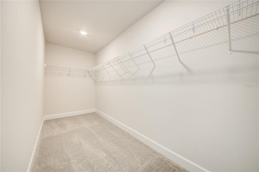 Spacious, unfurnished interior of a new home in Aviary at Rutland Ranch, Parrish (Image 27).