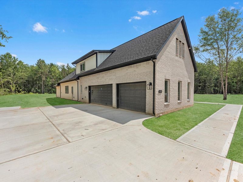 Front exterior of a new home in , Dayton, TX, highlighting curb appeal (Image 22).
