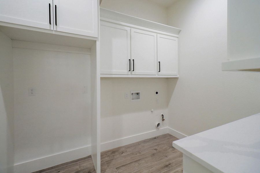 Spacious laundry room with space for another refrigerator Spacious laundry room with space for another refrigerator