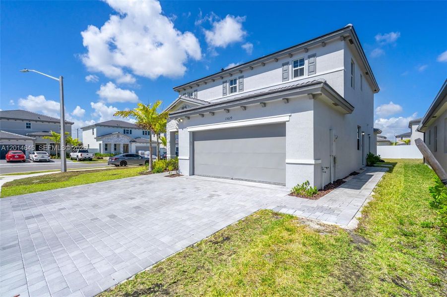 Front exterior of a new home in , Miami, FL, highlighting curb appeal (Image 24).