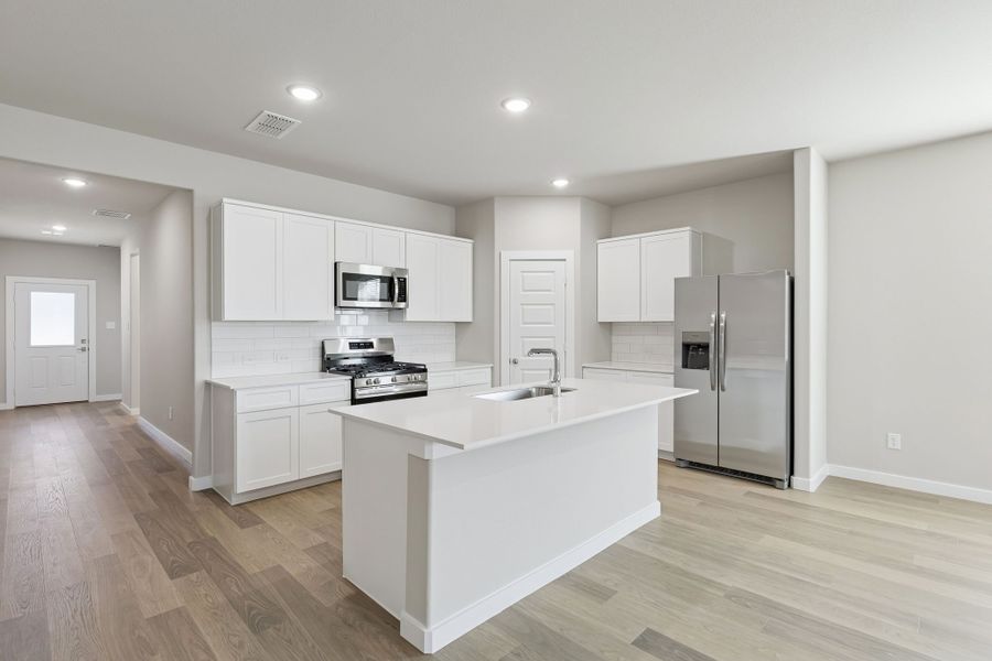 Kitchen in the Holden home plan by Trophy Signature Homes – REPRESENTATIVE PHOTO Kitchen in the Holden home plan by Trophy Signature Homes – REPRESENTATIVE PHOTO