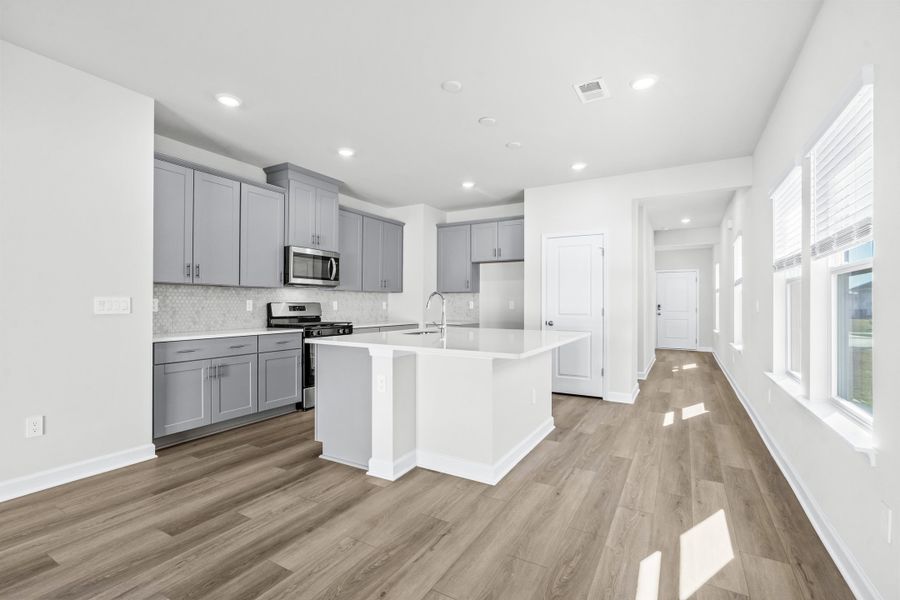 Furnished interior view inside a new home in Cypress Ridge - The Boardwalk Series, Longs (Image 4).