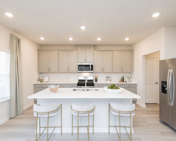 The beautiful granite countertop gives you ample space to prepare dinner or meal prep.