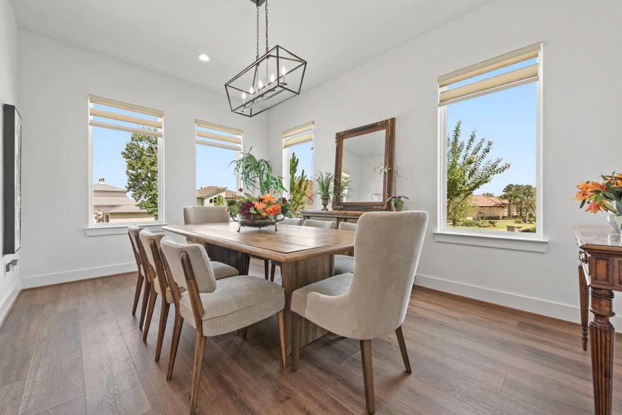 Sun filled dining room with front facing water Sun filled dining room with front facing water