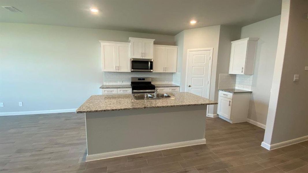 Kitchen- All Home and community information, including pricing, included features, terms, availability and amenities, are subject to change at any time without notice or obligation. All Drawings, pictures, photographs, video, square footages, floor plans, elevations, features, colors and sizes are approximate for illustration purposes only and will vary from the homes as built.