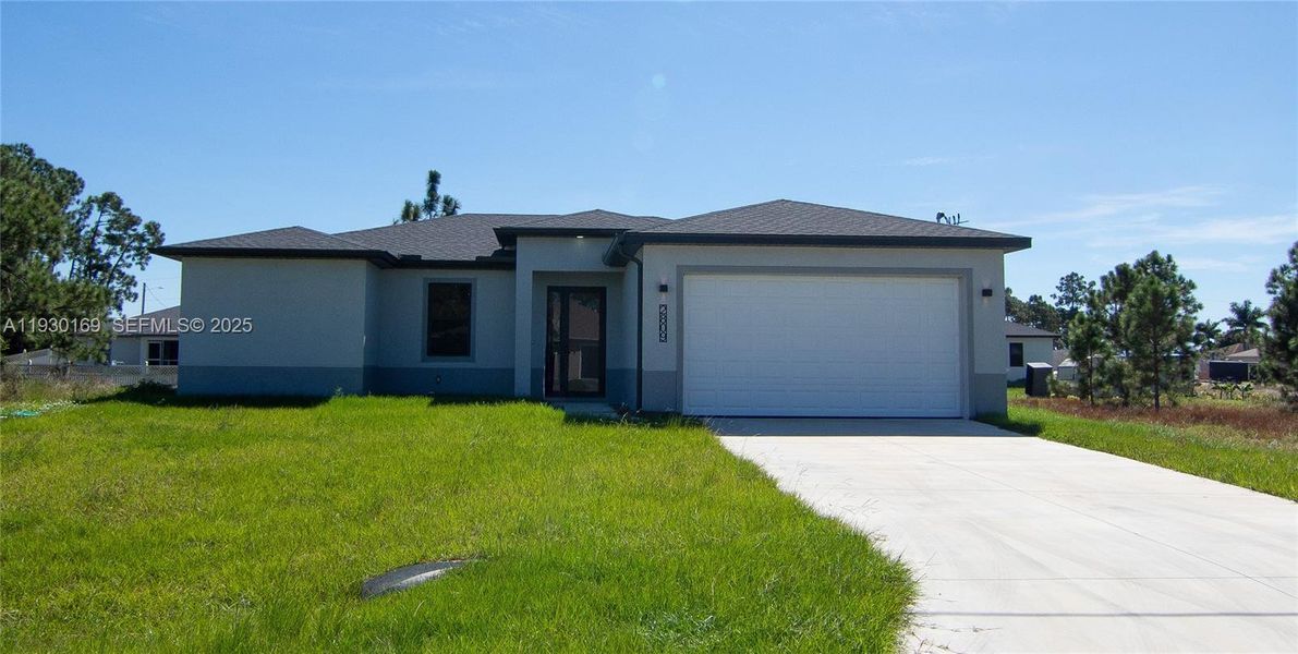 Front exterior of a new home in , Lehigh Acres, FL, highlighting curb appeal (Image 1). Front exterior of a new home in , Lehigh Acres, FL, highlighting curb appeal (Image 1).