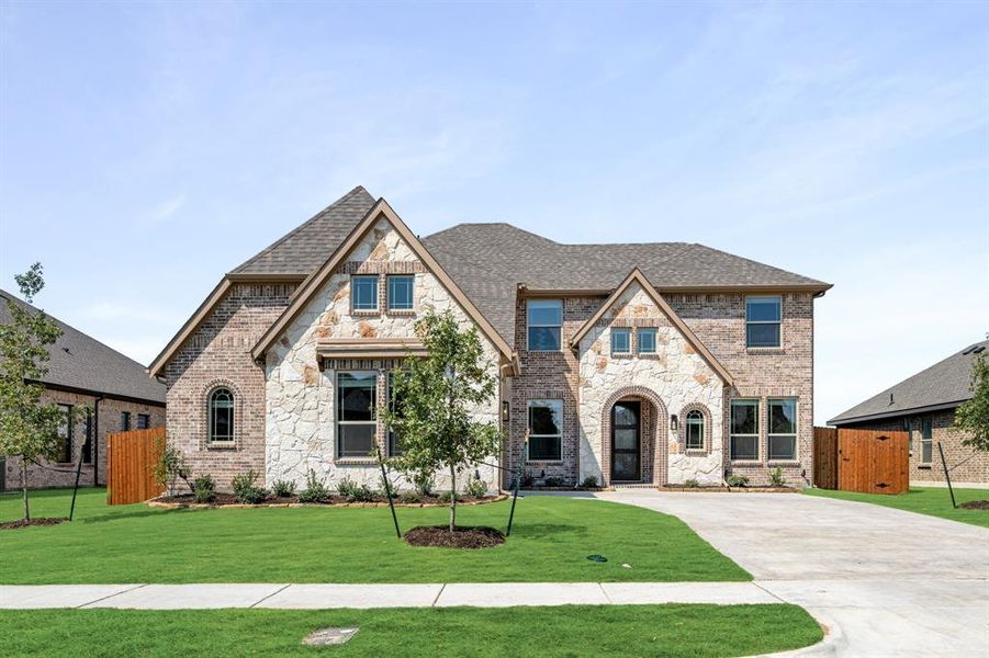 Front exterior of a new home in Villages of Walnut Grove, Midlothian, TX, highlighting curb appeal (Image 2). Front exterior of a new home in Villages of Walnut Grove, Midlothian, TX, highlighting curb appeal (Image 2).