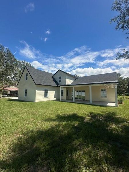Front exterior of a new home in , Lake Helen, FL, highlighting curb appeal (Image 27).