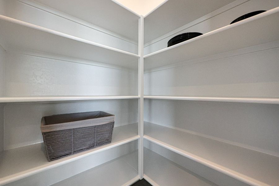 A white shelf with a vent.