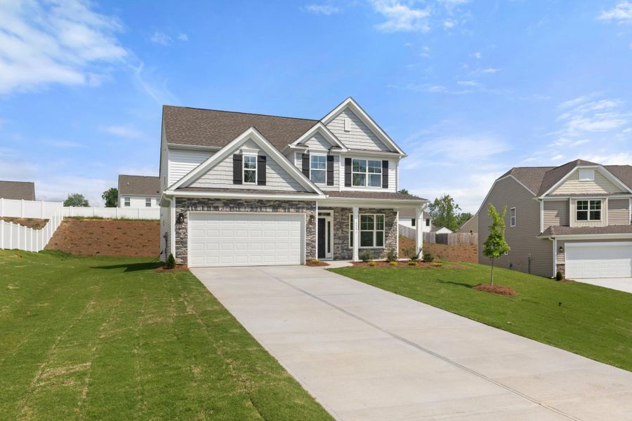 Front exterior of a new home in Cottages at Piper Village, Trinity, NC, highlighting curb appeal (Image 20).
