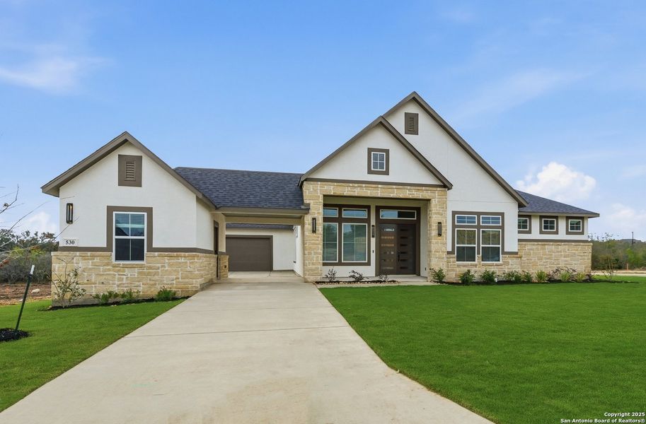 Front exterior of a new home in Potranco Oaks, Castroville, TX, highlighting curb appeal (Image 25).