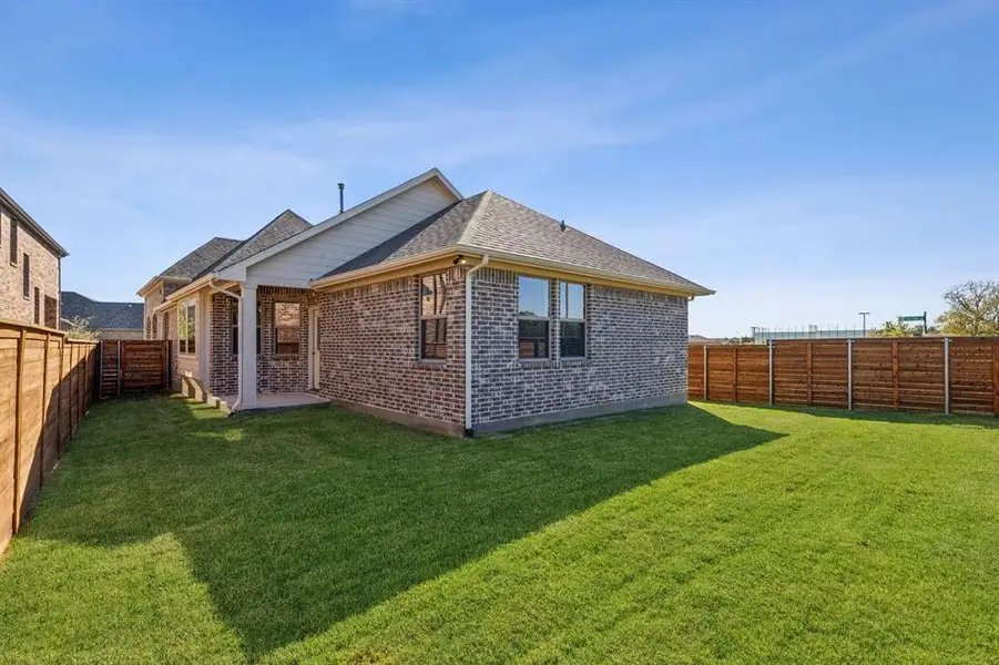 Exterior details and patio area of a home in Solterra Texas, Mesquite (Image 3).