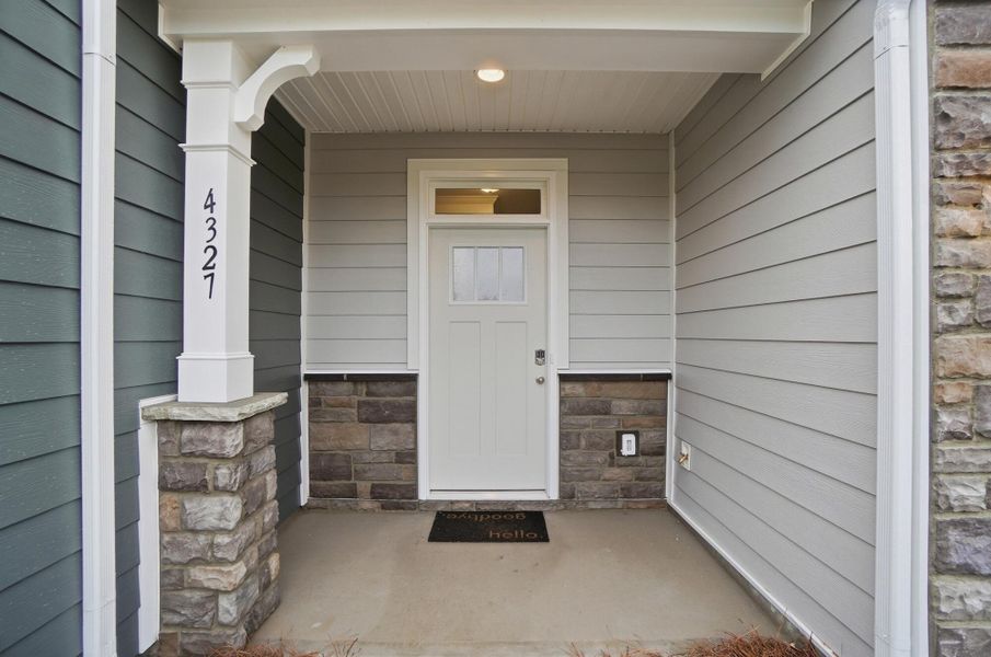 Exterior details and patio area of a home in Harrisburg Village Townhomes, Harrisburg (Image 3).