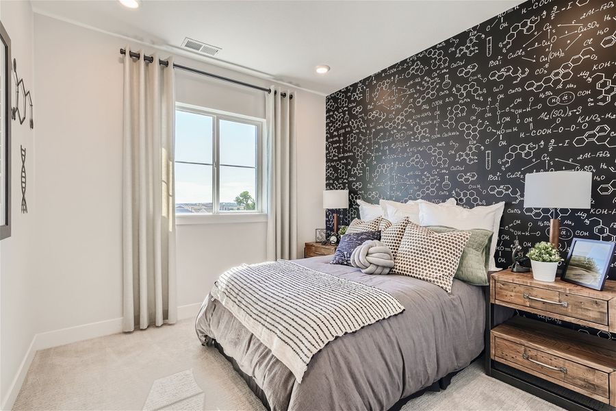 A bedroom with a bed and a window. A bedroom with a bed and a window.