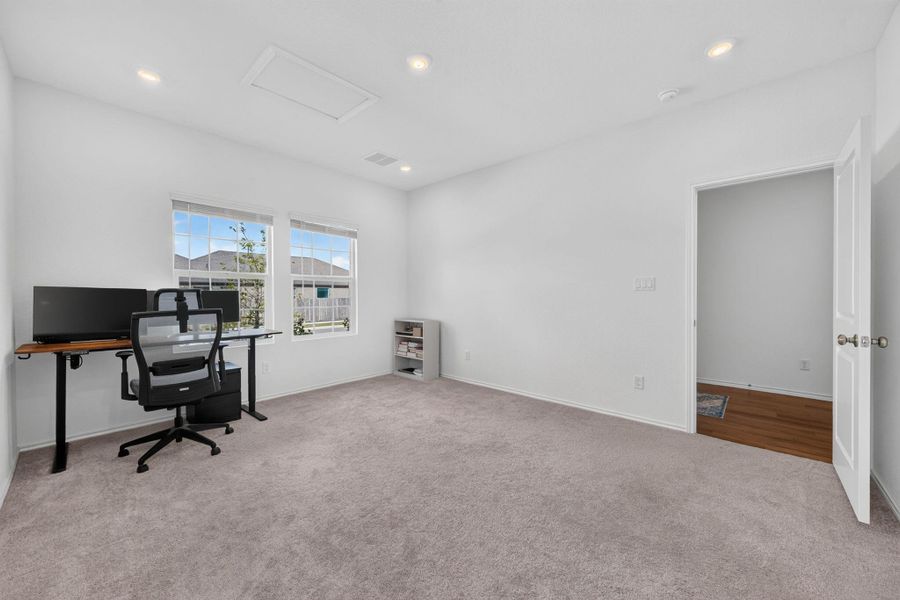 A versatile office space with abundant natural light from wide windows, offering potential for various uses. A versatile office space with abundant natural light from wide windows, offering potential for various uses.