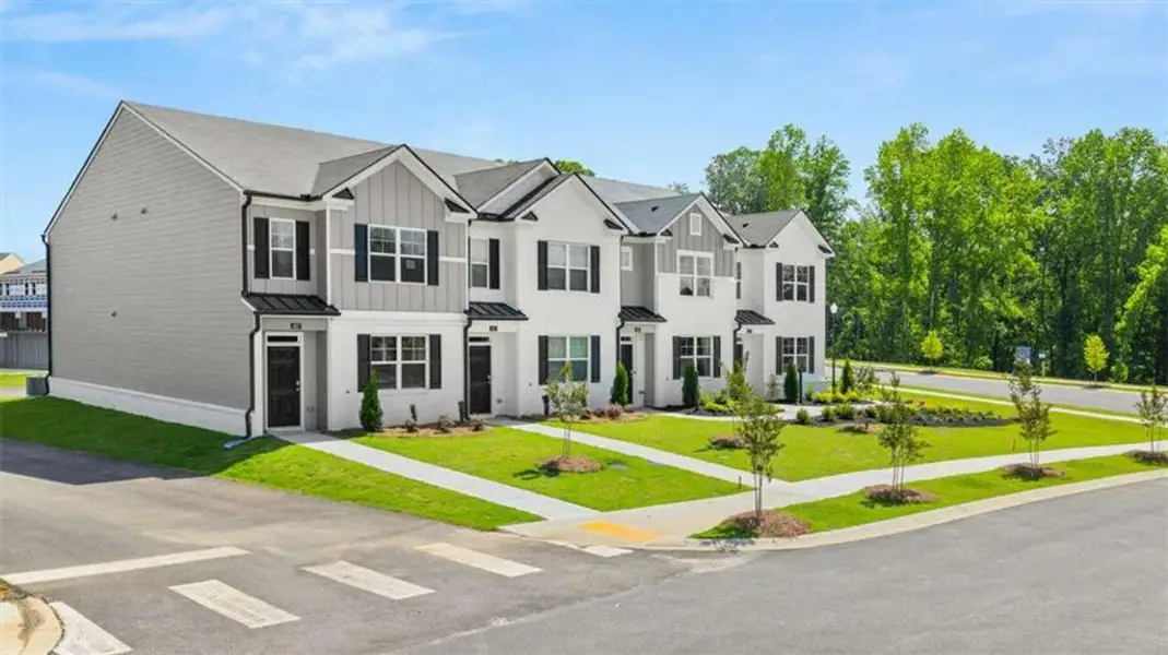 Front exterior of a new home in , Stockbridge, GA, highlighting curb appeal (Image 33).