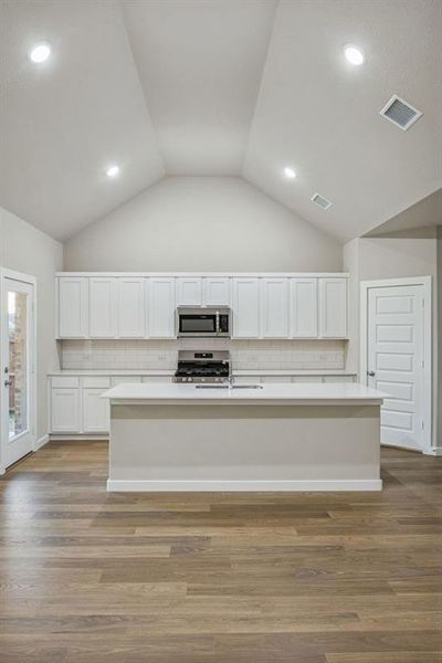 Kitchen in the Wimbledon home plan by Trophy Signature Homes – REPRESENTATIVE PHOTO