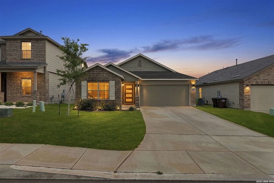 Front exterior of a new home in Hunters Ranch, San Antonio, TX, highlighting curb appeal (Image 24). Front exterior of a new home in Hunters Ranch, San Antonio, TX, highlighting curb appeal (Image 24).