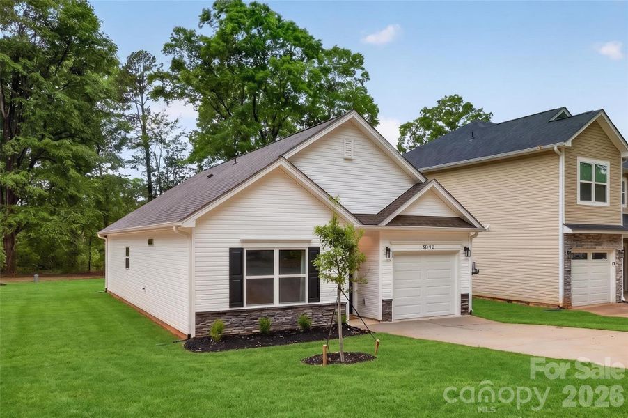 Front exterior of a new home in , Charlotte, NC, highlighting curb appeal (Image 23). Front exterior of a new home in , Charlotte, NC, highlighting curb appeal (Image 23).