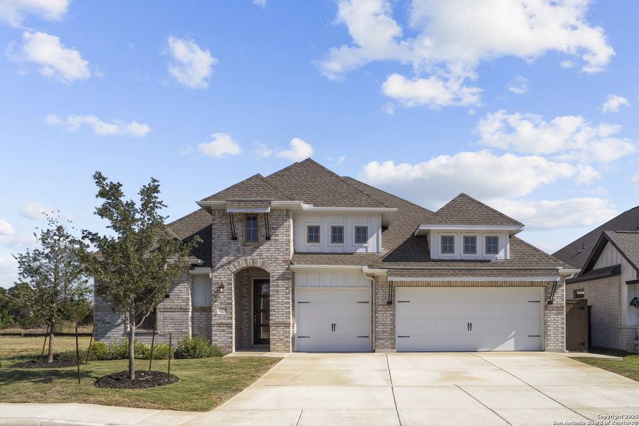 Front exterior of a new home in Stillwater Ranch, San Antonio, TX, highlighting curb appeal (Image 17). Front exterior of a new home in Stillwater Ranch, San Antonio, TX, highlighting curb appeal (Image 17).
