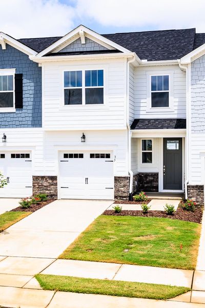 Front exterior of a new home in Vaughan Farms, Angier, NC, highlighting curb appeal (Image 2). Front exterior of a new home in Vaughan Farms, Angier, NC, highlighting curb appeal (Image 2).