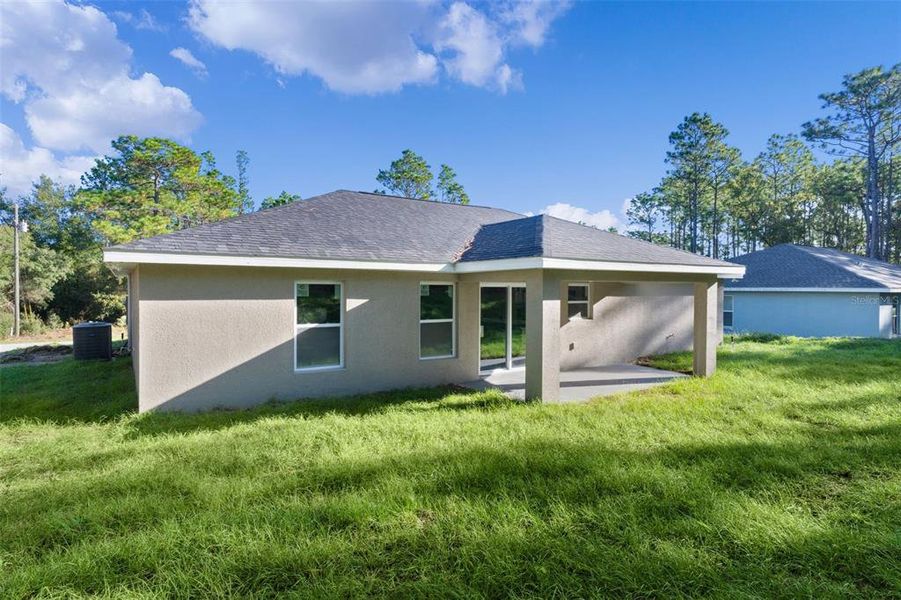 Exterior details and patio area of a home in , Citrus Springs (Image 26).