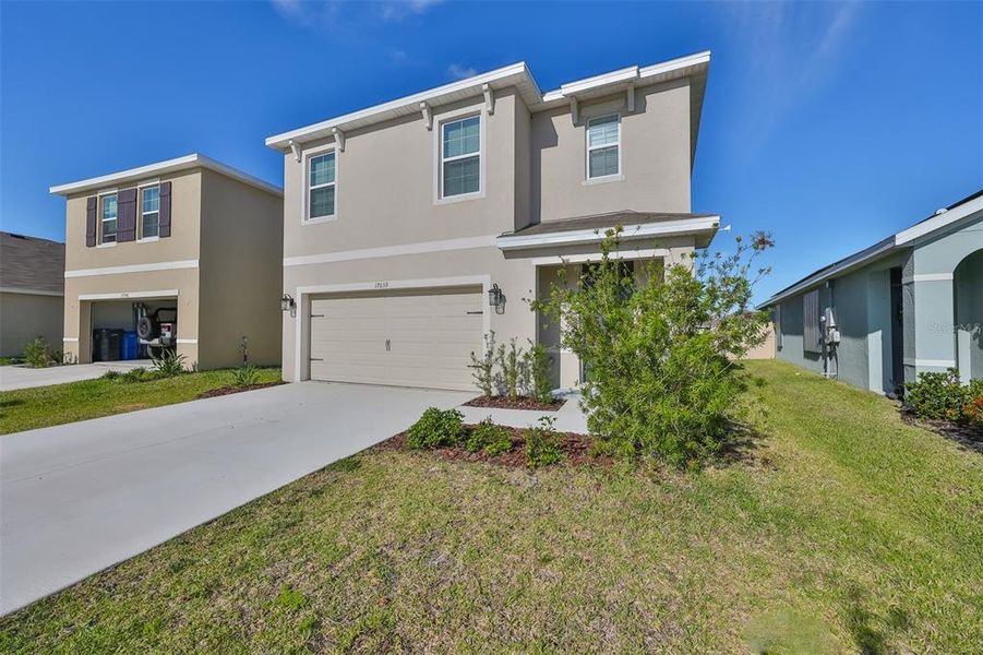 Front exterior of a new home in Southshore Bay, Wimauma, FL, highlighting curb appeal (Image 18). Front exterior of a new home in Southshore Bay, Wimauma, FL, highlighting curb appeal (Image 18).